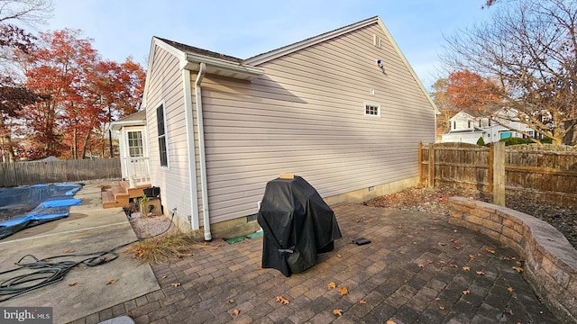 view of property exterior featuring a patio area