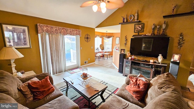 living room with ceiling fan, light carpet, and high vaulted ceiling