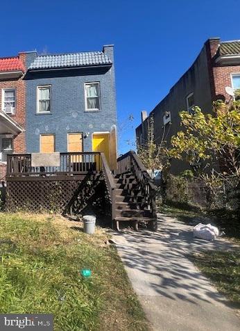 back of property featuring a wooden deck