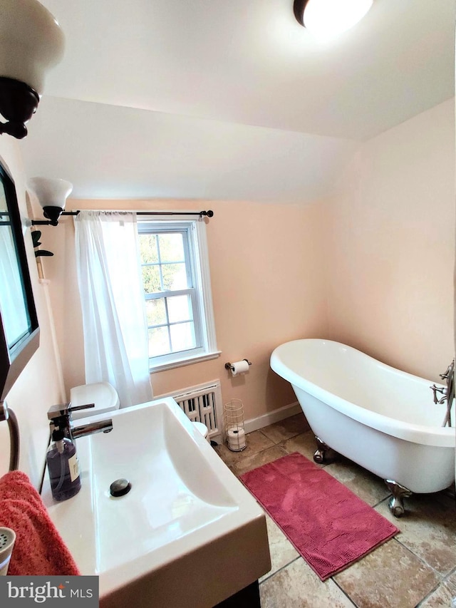 bathroom with sink and a tub