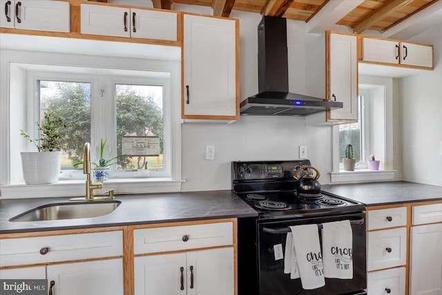 kitchen featuring sink, wall chimney range hood, black electric range, beamed ceiling, and white cabinets