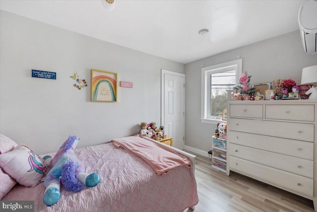 bedroom with light hardwood / wood-style floors