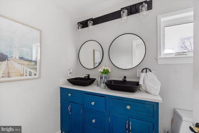 bathroom with vanity and toilet