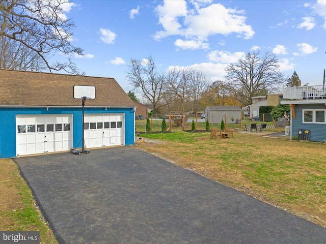 garage with a lawn