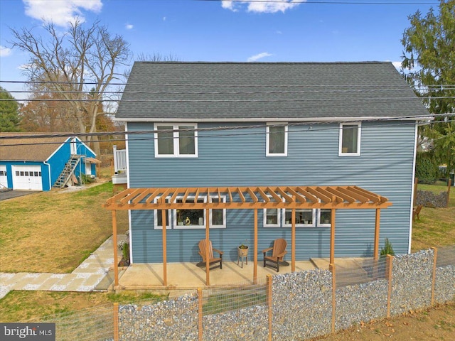 view of front facade featuring a pergola, a patio, and a front lawn