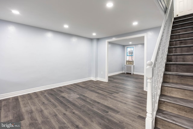 basement with dark wood-type flooring