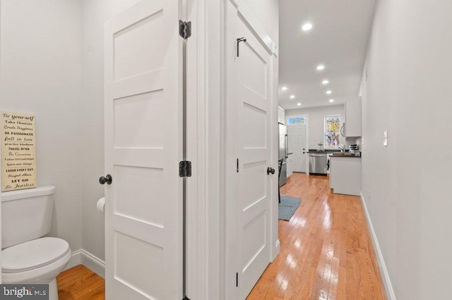 hall with light hardwood / wood-style flooring