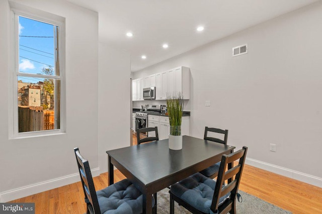 dining room featuring light hardwood / wood-style flooring