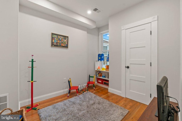 game room featuring hardwood / wood-style floors