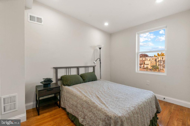 bedroom featuring hardwood / wood-style flooring