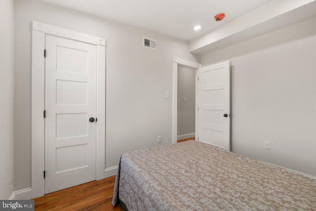 bedroom featuring hardwood / wood-style flooring