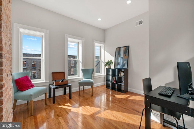 living area with light hardwood / wood-style flooring