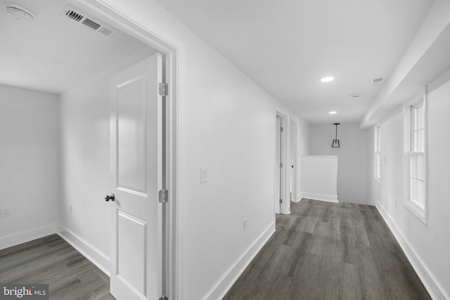 hall with dark hardwood / wood-style floors