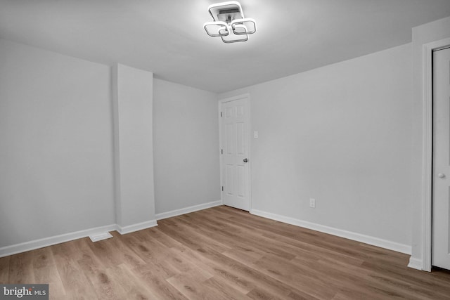 unfurnished room featuring hardwood / wood-style floors