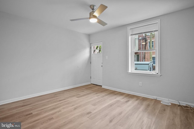 unfurnished room with ceiling fan and light hardwood / wood-style flooring