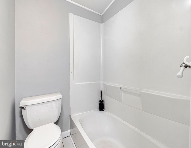 bathroom featuring toilet and a bathing tub