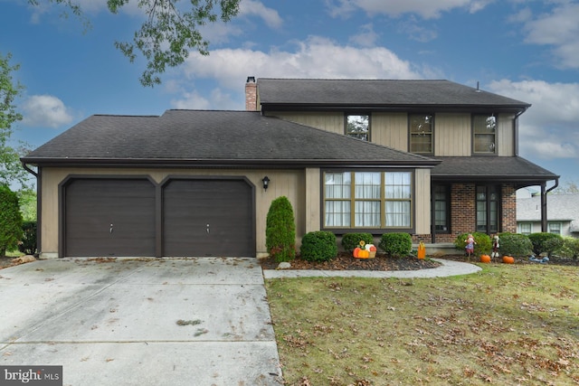 view of front of property with a garage and a front lawn