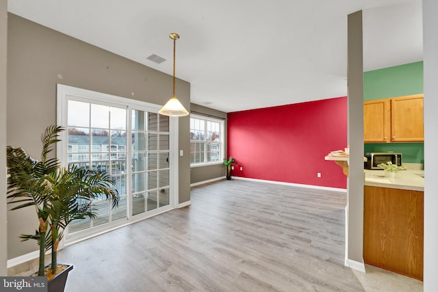 dining space featuring light hardwood / wood-style flooring