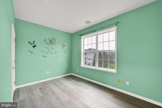 unfurnished room featuring light wood-type flooring