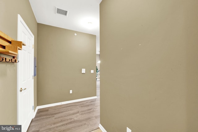 corridor featuring light hardwood / wood-style floors