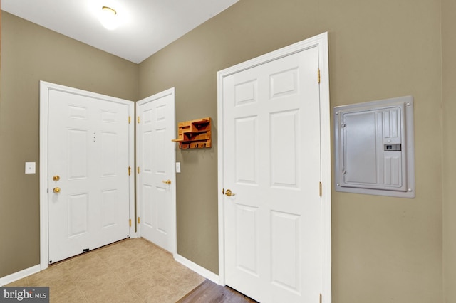 entrance foyer with electric panel and light wood-type flooring