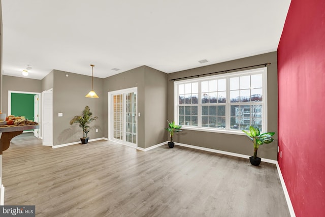 unfurnished room with wood-type flooring