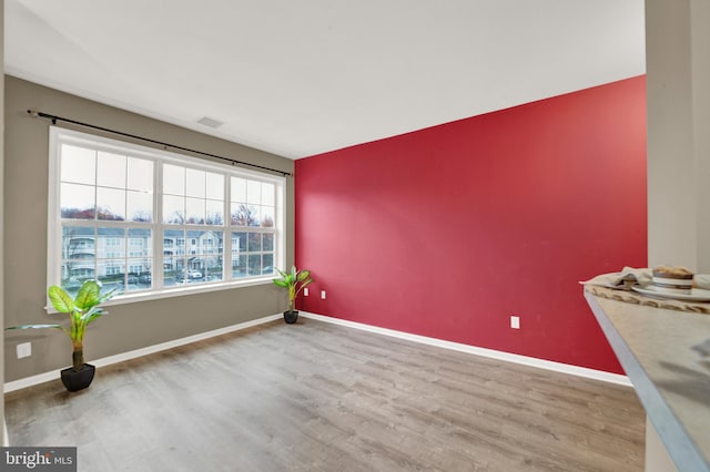 empty room with wood-type flooring