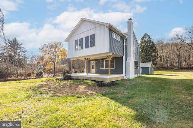 back of property featuring a yard