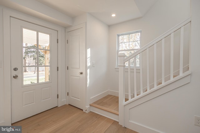 entrance foyer with light hardwood / wood-style flooring