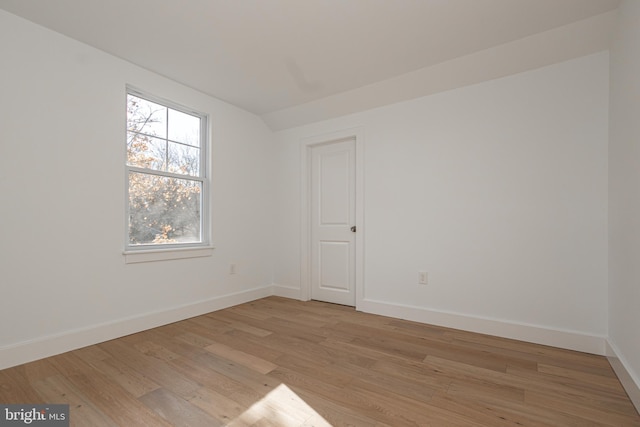 empty room with light hardwood / wood-style flooring