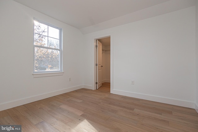 spare room featuring light hardwood / wood-style flooring