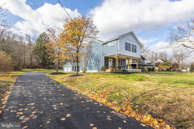 view of front of home featuring a front lawn and a porch