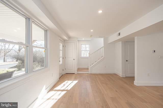 spare room with light wood-type flooring