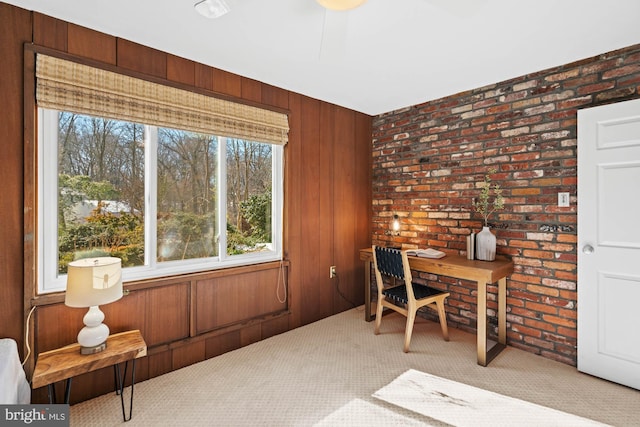 carpeted office with brick wall and wooden walls