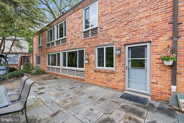 back of property featuring a patio area