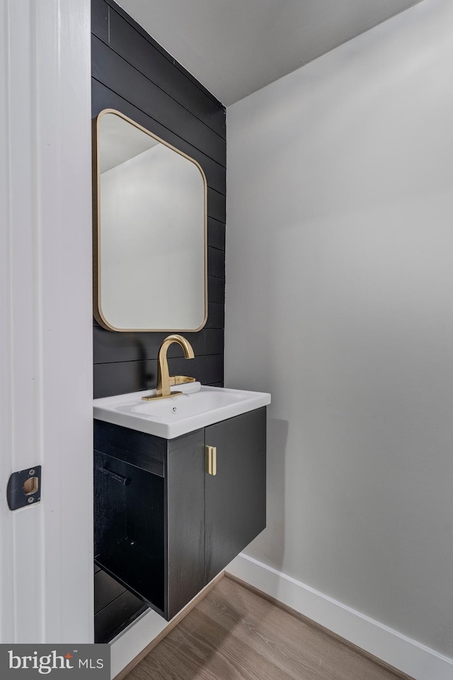 bathroom featuring hardwood / wood-style floors and vanity