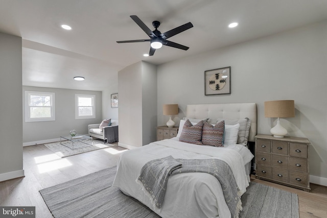 bedroom featuring light hardwood / wood-style flooring and ceiling fan