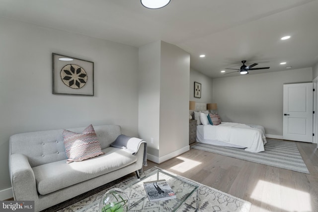 bedroom with ceiling fan and hardwood / wood-style flooring