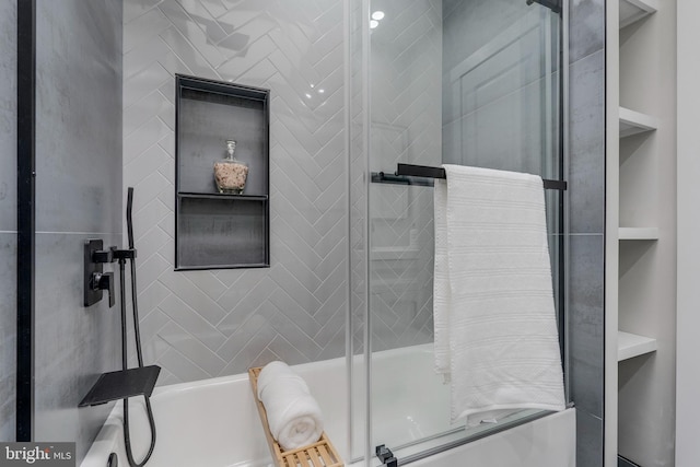 bathroom featuring built in shelves and separate shower and tub