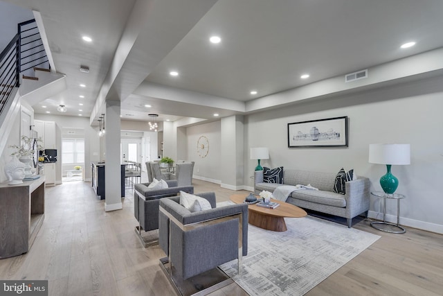 living room with light hardwood / wood-style floors