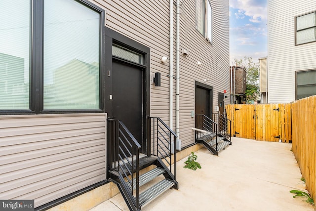 doorway to property with a patio