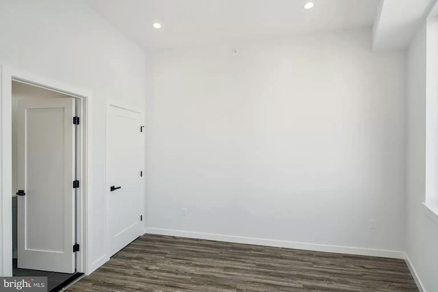 spare room with dark hardwood / wood-style flooring