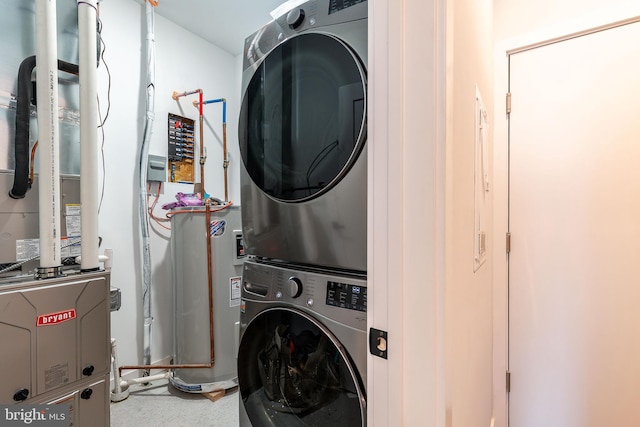 laundry room featuring heating unit and stacked washer and clothes dryer