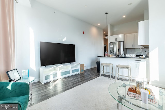 living room with dark hardwood / wood-style floors