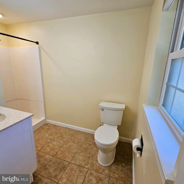 bathroom with tile patterned floors, toilet, a shower, and vanity