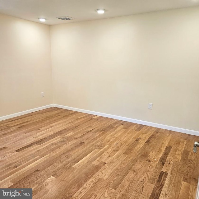 spare room featuring light hardwood / wood-style flooring