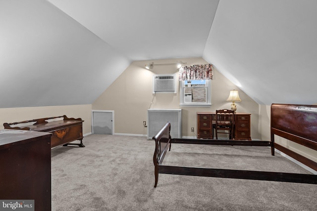 carpeted bedroom featuring a wall mounted air conditioner and vaulted ceiling