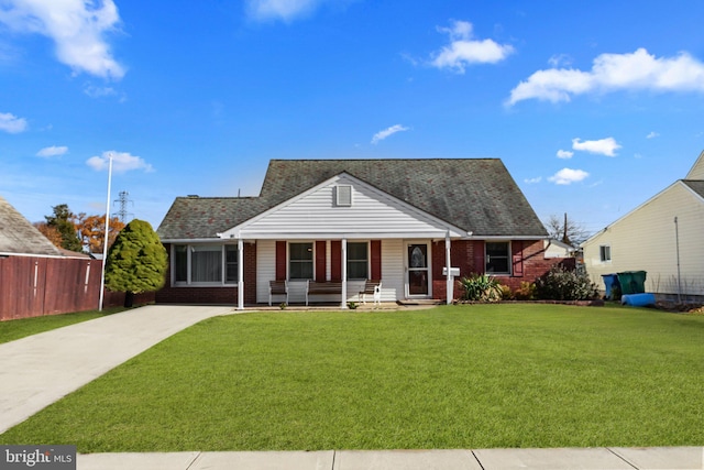 bungalow-style home featuring a porch and a front yard