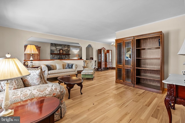 living room featuring light hardwood / wood-style flooring and a notable chandelier