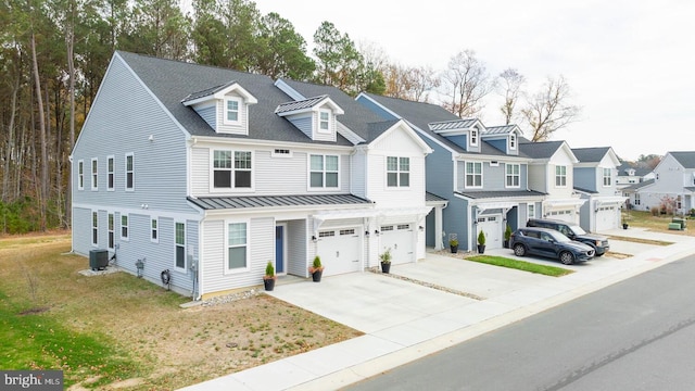 multi unit property with central AC unit and a garage